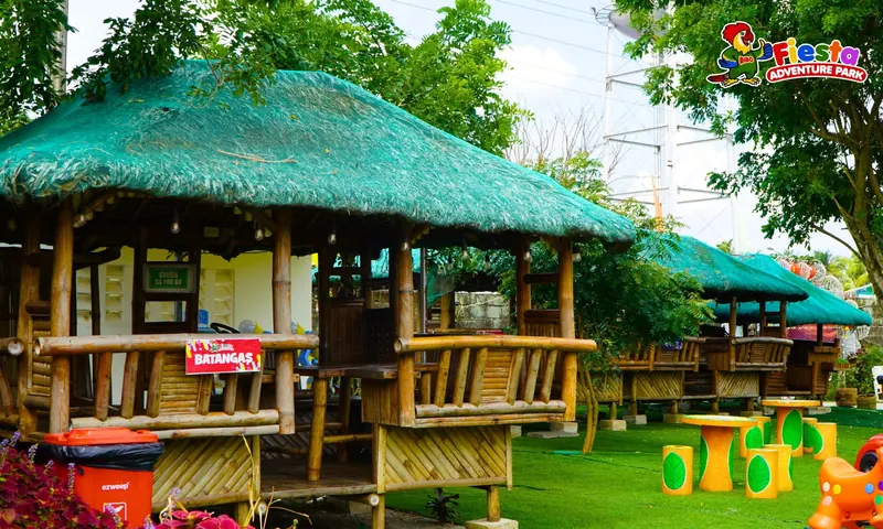 Bamboo and nipa huts with picnic tables for shaded dining