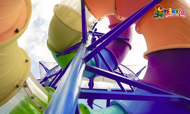 Close-up of the purple and yellow spinner ride arms
